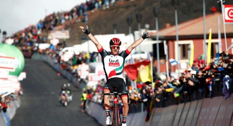 Slovenia's Jan Polanc of team UAE Emirates celebrates as he crosses the finish line to win the 4th stage of the 100th Giro d'Italia, Tour of Italy, cycling race from Cefalu to Etna volcano, on May 9, 2017 in Sicily