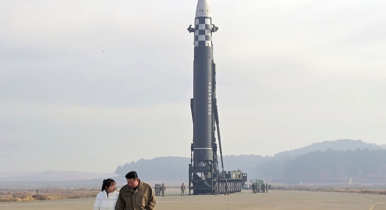 This photo provided on Nov. 19, 2022, by the North Korean government shows North Korean leader Kim Jong Un, right, and his daughter at the site of a missile launch at Pyongyang International Airport in Pyongyang, North Korea, Friday, Nov. 18, 2022.Korean Central News Agency/Korea News Service via Associated Press