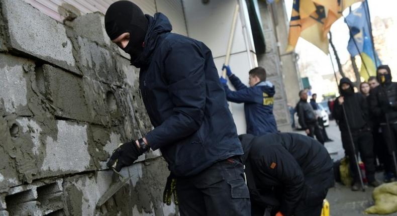 Activists blocking access to the offices of Sberbank helped push the Russian bank out of Ukraine