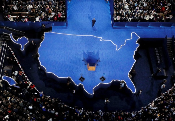 U.S. Democratic presidential nominee Hillary Clinton's campaign chairman Podesta walks off the stage