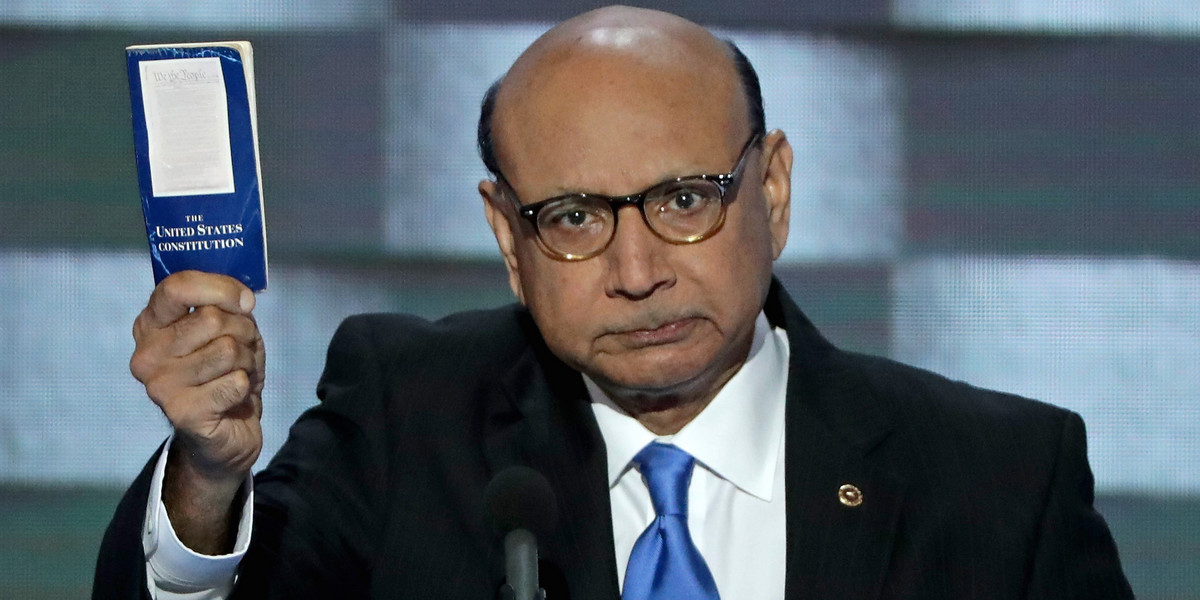 Khizr Khan, father of deceased Muslim US soldier, holds up a booklet of the US Constitution as he delivers remarks on the fourth day of the Democratic National Convention in Philadelphia.