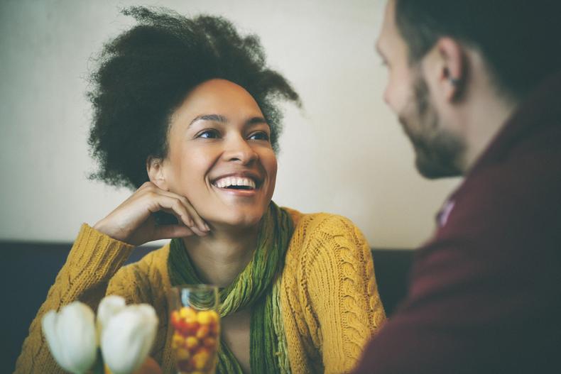 Happy woman on a date [Credit everyday feminism]