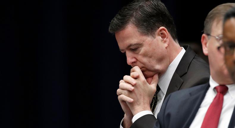 FBI Director James Comey listens before a meeting of the Attorney General's Organized Crime Council and Organized Crime Drug Enforcement Task Forces (OCDETF) Executive Committee to discuss implementation of the President's Executive Order 13773, at the Department of Justice, Tuesday, April 18, 2017, in Washington.