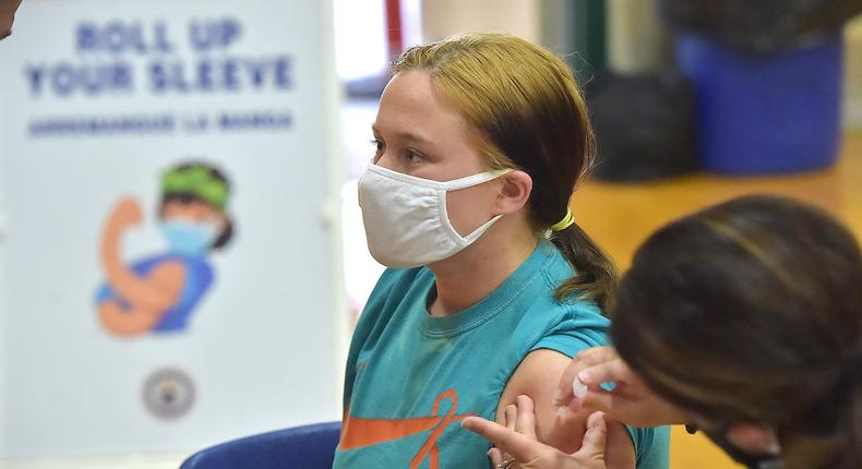Junior Molly Day gets her first Pfizer Biontech COVID vaccine at Ridley High School in Ridley, Pennsylvania on May, 3, 2021.
