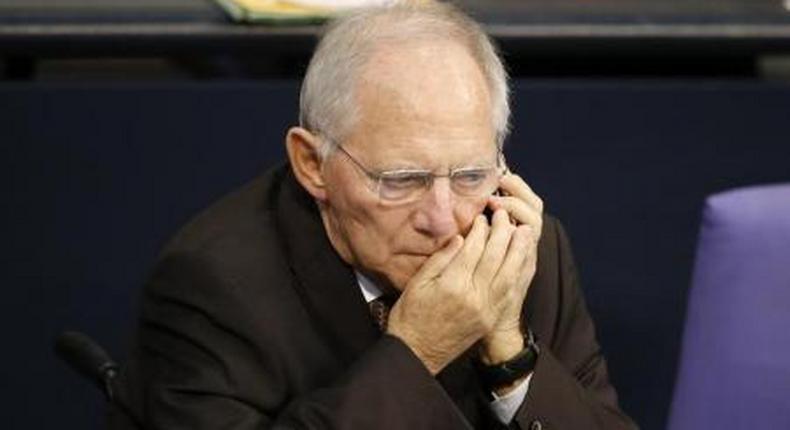 German Finance Minister Wolfgang Schaeuble uses his phone during a session of the German lower house of parliament, the Bundestag, in Berlin, Germany November 25, 2015.