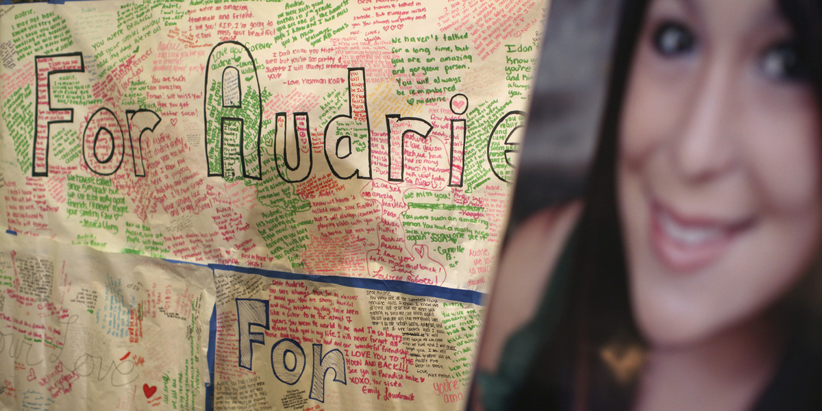 A message board and portrait of Audrie Pott are shown at a news conference in San Jose, California April 15, 2013.