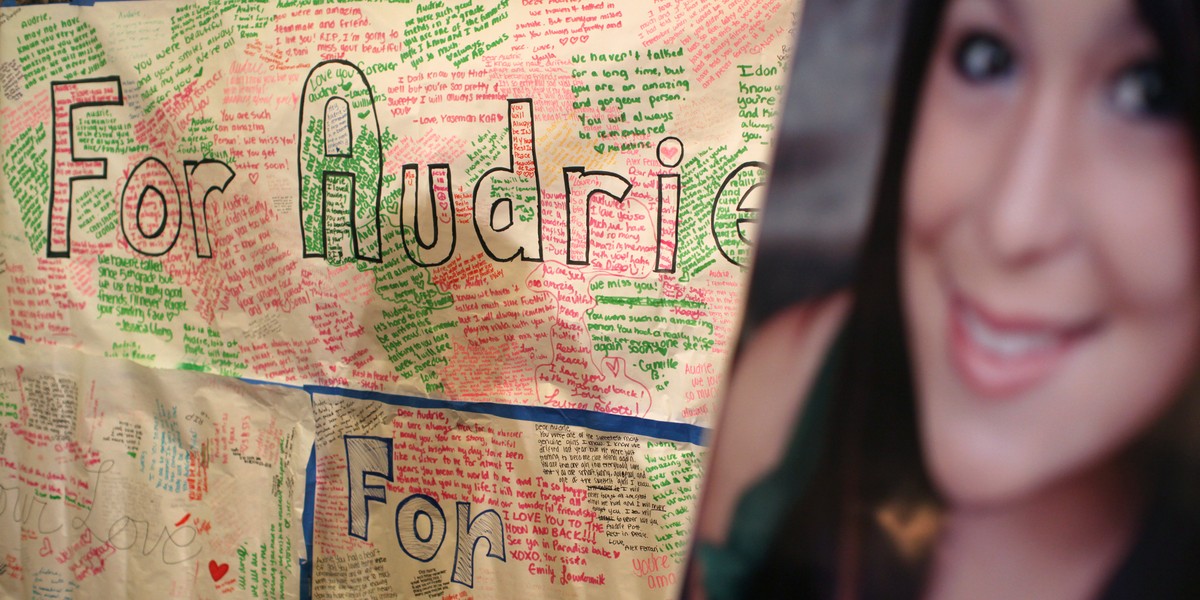 A message board and portrait of Audrie Pott are shown at a news conference in San Jose, California April 15, 2013.