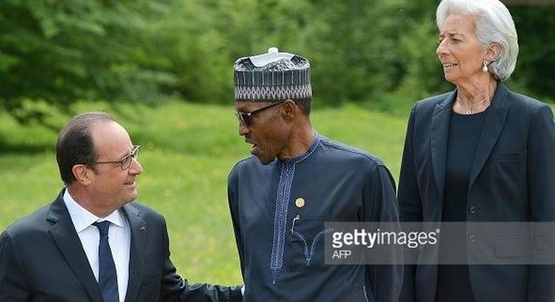 President Muhammadu Buhari discusses with French counterpart, Francois Hollande as IMF Managing Director, Christine Lagarde looks on.
