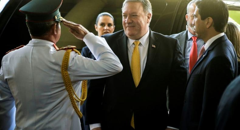 U.S. Secretary of State Mike Pompeo is welcomed by Paraguay's Military Cabinet Chief General Roque Alberto Sotelo (L) and Ambassador Federico Gonzalez (R) at the presidential palace in Asuncion