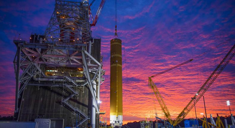 Crews at Stennis Space Center lift the core stage of NASA's Space Launch System into place at test stand B-2 on January 22, 2020.