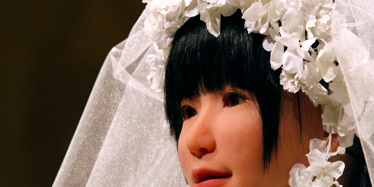 The HRP-4C humanoid robot "Miim" wearing a wedding dress by Japanese designer Yumi Katsura.