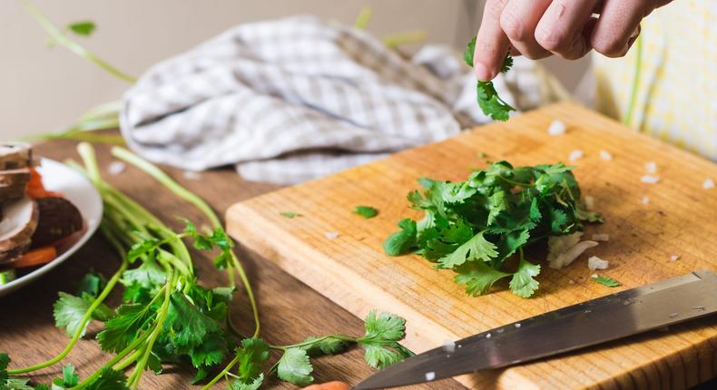 Cilantro is used in a wide variety of dishes and can last for weeks when stored properly.Mnica Durn / EyeEm/Getty Images