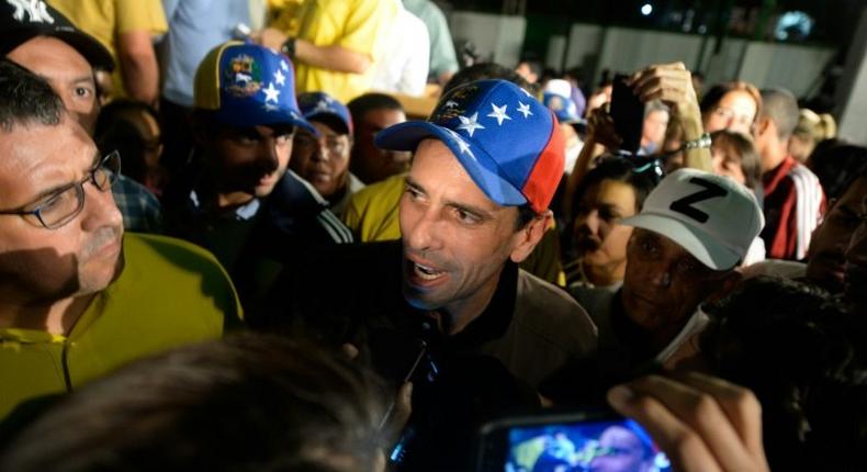 Venezuelan opposition leader Henrique Capriles (C) told the media in Caracas If the dictatorship is squealing, it is a sign that we are making progress