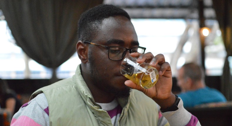 A beer lover down a glass of beer at Nairobi Beer Festival. (courtesy)