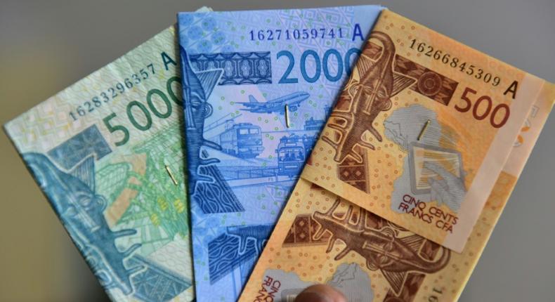 Some economists urge West Africa to hold on to national currencies