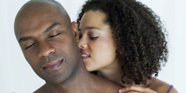 Black couple kissing