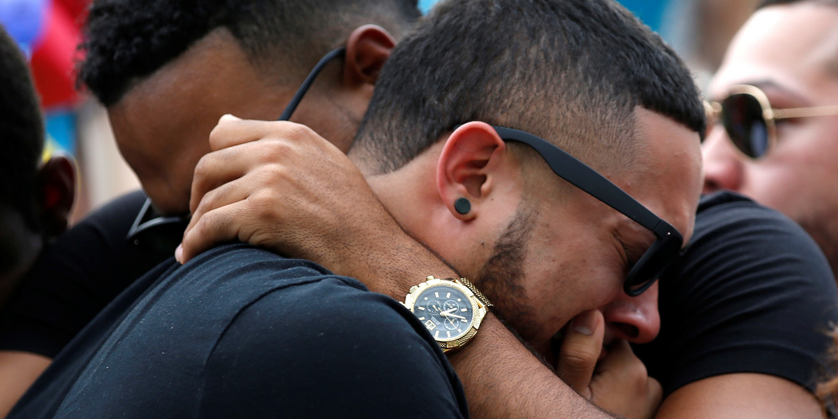 People at a memorial service on Monday, the day after the shooting at the gay nightclub Pulse in Orlando, Florida.
