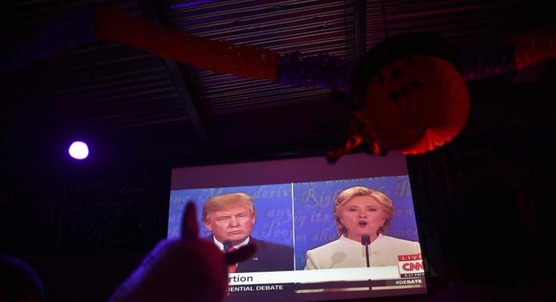 Locals and Americans watch the final presidential debate between Hillary Clinton and Donald Trump at a bar-restaurant in Mexico City