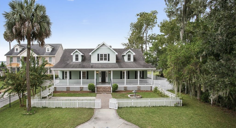 Full of southern charm, this $975,000 Wilmington Island house overlooks the Wilmington River and comes with its own private dock and sun deck.