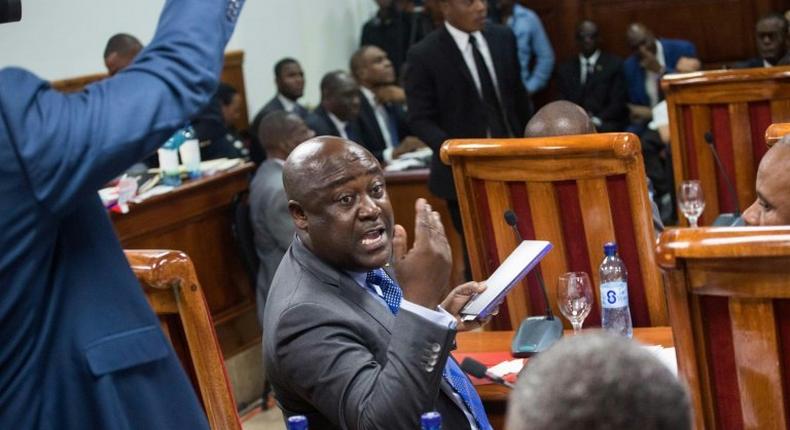 Haitian Senator Evaliere Beauplan debates with his colleagues during the marathon ratification session of Prime Minister Jean Henry Ceant's general government policies