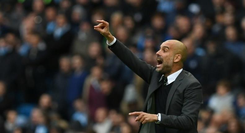 Manchester City's manager Pep Guardiola yells on the touchline on October 23, 2016