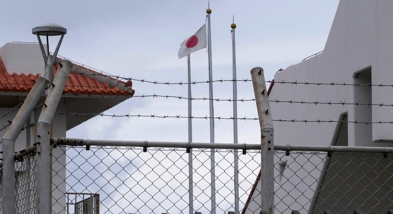 A Japanese flag waves inside the fence of the Japan Self-Defense Forces base on Yonaguni.Ayaka McGill/AP