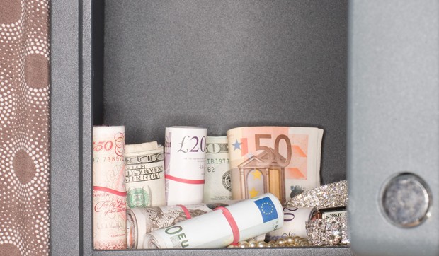 Money and jewelry inside a safe