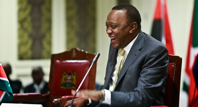 President Uhuru Kenyatta laughing