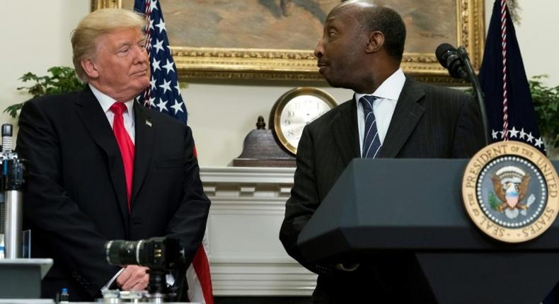 Merck CEO Kenneth Frazier is seen here with President Donald Trump at a White House event in July.