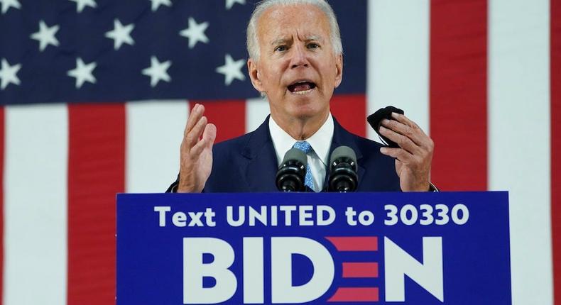 Democratic U.S. presidential candidate and former Vice President Joe Biden holds his protective face mask as he speaks about the Trump administration's handling of the coronavirus pandemic during a campaign event in Wilmington, Delaware, U.S., June 30, 2020.