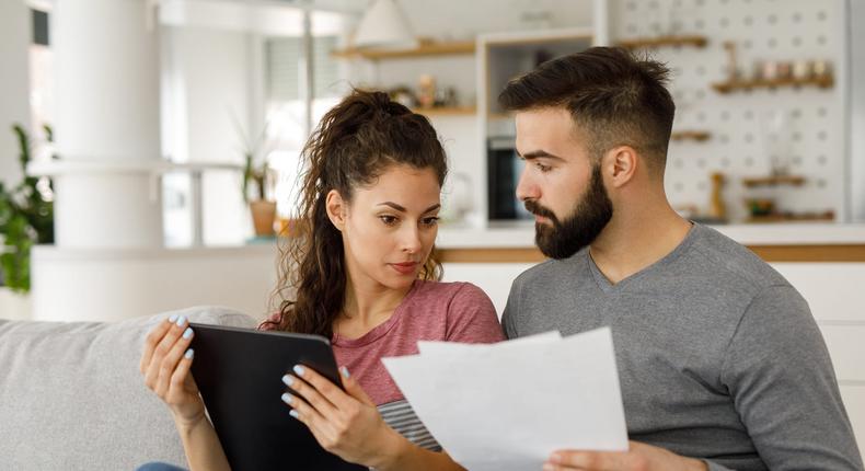 couple at home doing paperwork