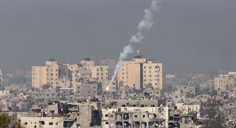 A picture taken from the southern Israeli city of Sderot on October 26, 2023 shows flares fired by the Israeli army over the northern Gaza Strip.Jack Guez/AFP via Getty Images