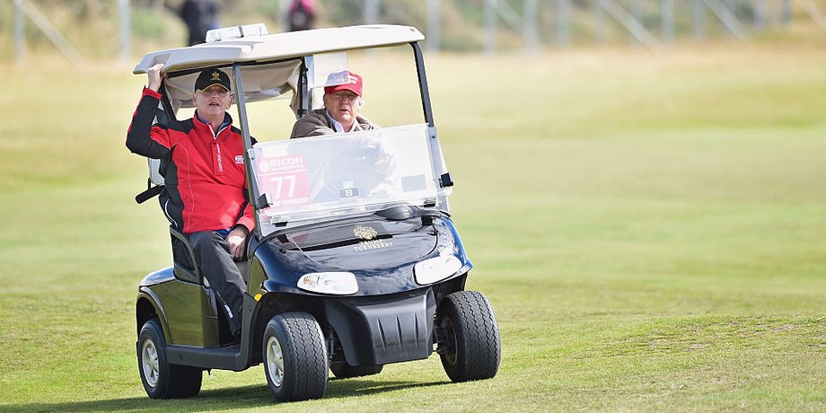 Then-Republican Presidential Candidate Donald Trump drives a golf buggy during his visits to his Scottish golf course Turnberry on July 30, 2015 in Ayr, Scotland.