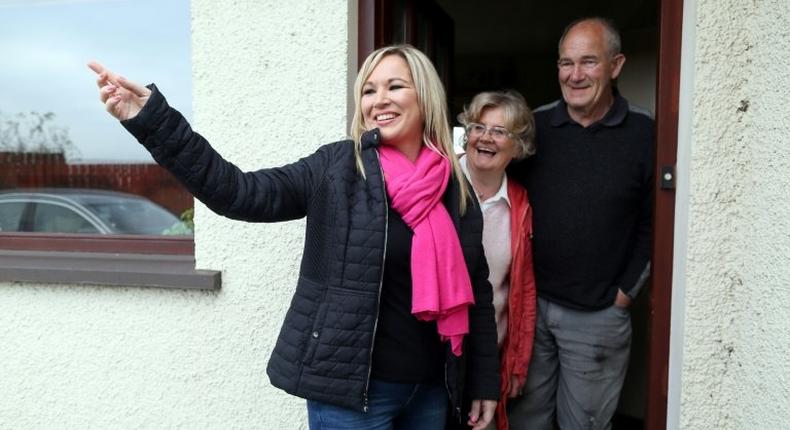 Sinn Fein's new Northern leader, Michelle O'Neill (L) meets local residents in Toome.