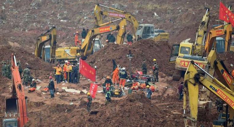 Rescuers pull first body from rubble of China landslide
