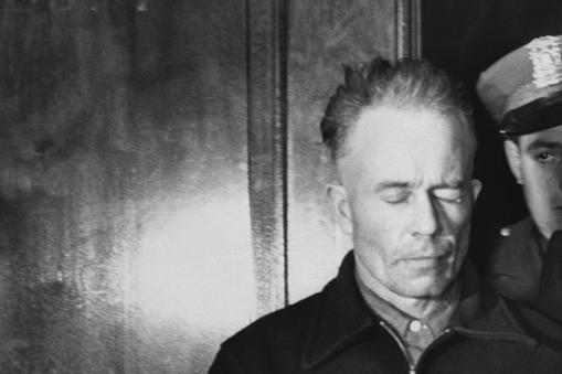 Ed Gein Being Led in Handcuffs