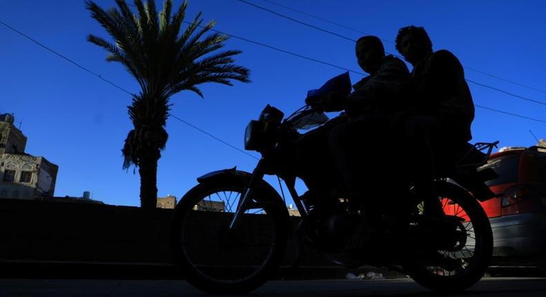 Motorcyclists ride in November 2018 through Yemen's capital Sanaa, where the Baha'i community says one of its members faces an appeal of a death sentence