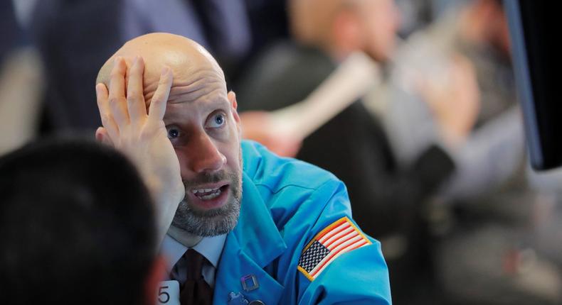 Traders work on the floor of the New York Stock Exchange shortly before the closing bell as the market takes a significant dip in New York, U.S., February 25, 2020.