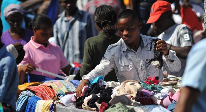 A young used-clloth (Okrika) seller in one of its major market in Lagos