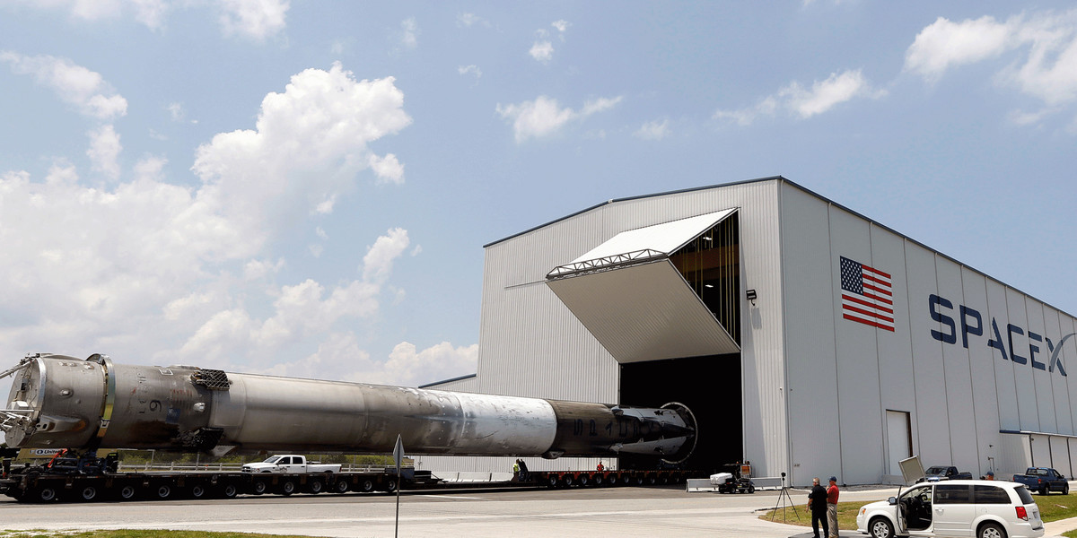 The recovered first stage of a SpaceX Falcon 9 rocket being transported to the SpaceX hangar at the launch pad 39A at the Kennedy Space Center in Cape Canaveral, Florida.