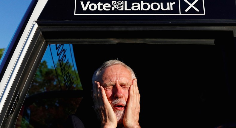 Jeremy Corbyn, leader of Britain's opposition Labour Party, reacts as he gets on a bus after a campaign event in Leeds, Britain May 9, 2017.