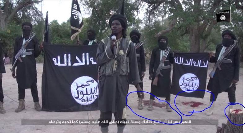 Screen shot from Boko Haram video showing amputation of two men's hands