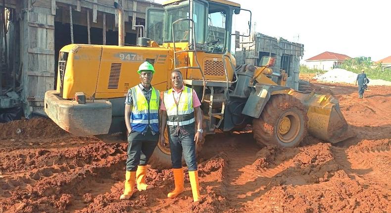Atwine (right) with one of his workmates at a construction site