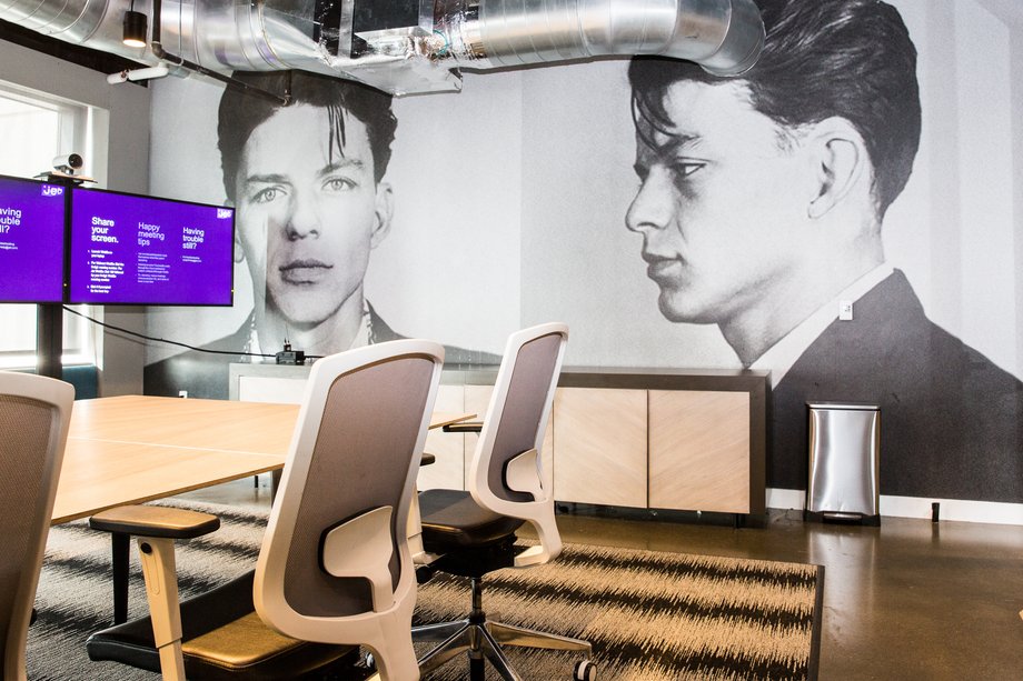 Some conference rooms allude to the office's New Jersey location, like this mural of a young Frank Sinatra, who was born in Hoboken.