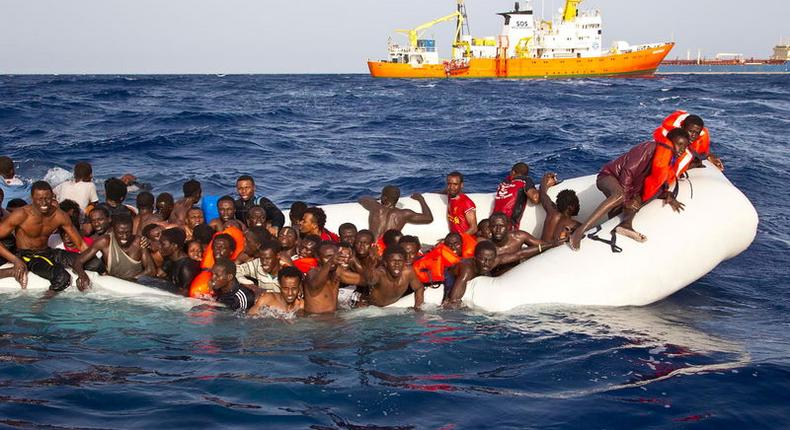 Migrants sit in a rubber dinghy during a rescue operation by SOS Mediterranee ship Aquarius off the coast of the Italian island of Lampedusa in this handout received April 18, 2016. 