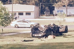 A Tesla Model S involved in the fatal crash on is shown with the top third of the car sheared off by