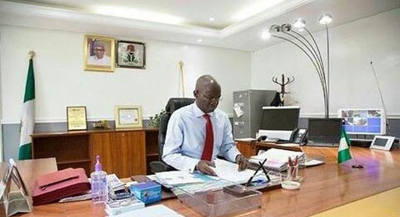 Minister of Power, Works and Housing in his office in Abuja