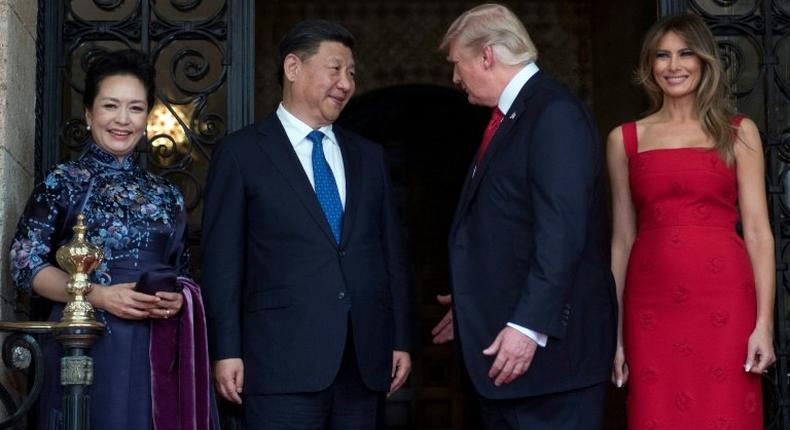 US First Lady Melania Trump and US President Donald Trump welcome Chinese President Xi Jinping and his wife Peng Liyuan to the Mar-a-Lago estate in West Palm Beach, Florida