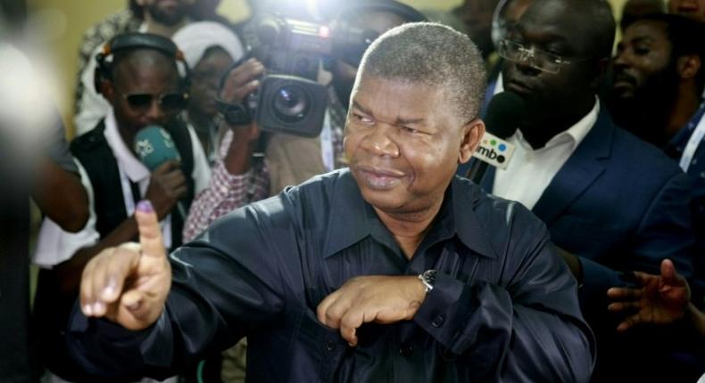 Joao Lourenco, the expected successor to Angola's longtime President Jose Eduardo dos Santos, shows his inked finger after voting in Luanda
