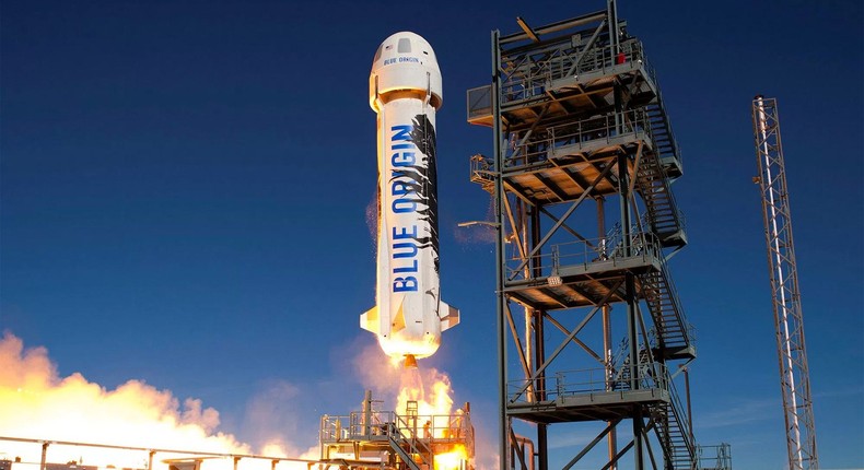 Blue Origin's reusable New Shepard suborbital rocket launches toward space in 2016.